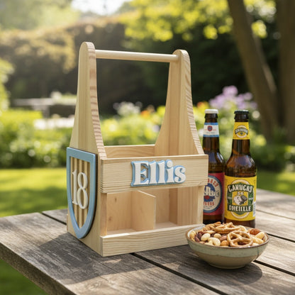 Wooden beer carrier with 'Ellis' and number '18' on a table outdoors.