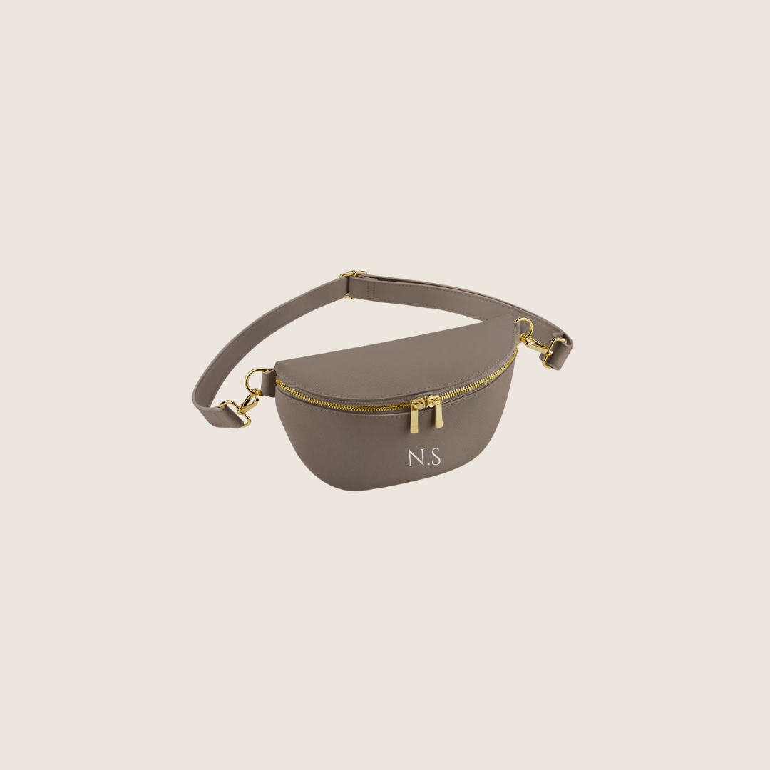 Taupe waist/Belt/Bum bag with gold accents on a beige background